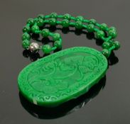 Carved Jade large oval pendant & necklace: Carved with a wild horse, with bead necklace.