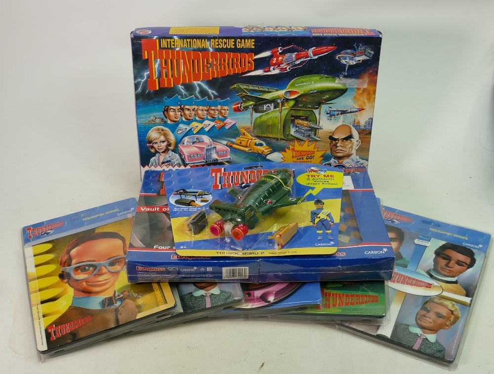 A collection of Thunderbird items to include : Carlton carded TB2 figure, similar mouse mats,