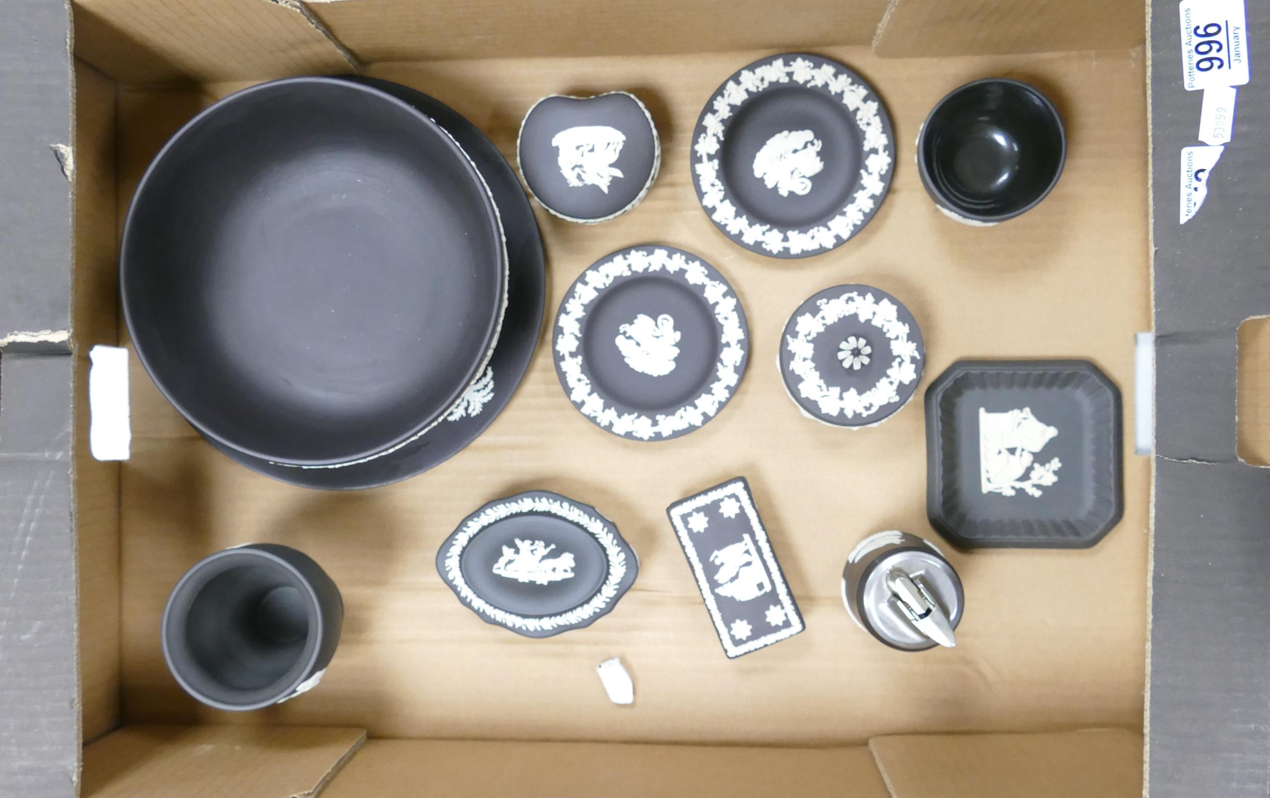 A collection of Wedgwood black bassalt items to include: lidded boxes, pin trays, large footed bowl,