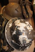 A collection of Military item to include: Metal Helmets, Brass Horn, Leather Hat etc