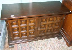 A reproduction dark oak side cabinet/media unit: 102cm wide.