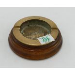 Brass Ashtray in Wooden base taken from Metal & Teak from HMS Mauretania 1907-1935: diameter 15.5cm