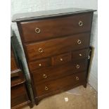 Reproduction dark oak chest of 7 drawers: brass loop handles, 82cm wide.