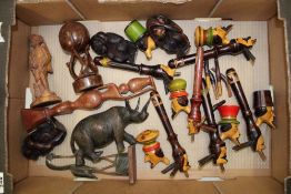 A collection of carved African themed items: animals, pipes etc (1 tray).