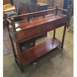 Reproduction dark teak side/serving table: 3 drawers and brass detailing, 102cm wide.