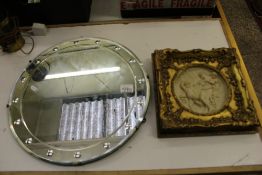 A mid century circular wall mirror: together with a gilt/gesso framed classical plaque (2).