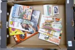 A mixed collection of items to include: vintage cigarette cards, Children Annuals & Ladybird books