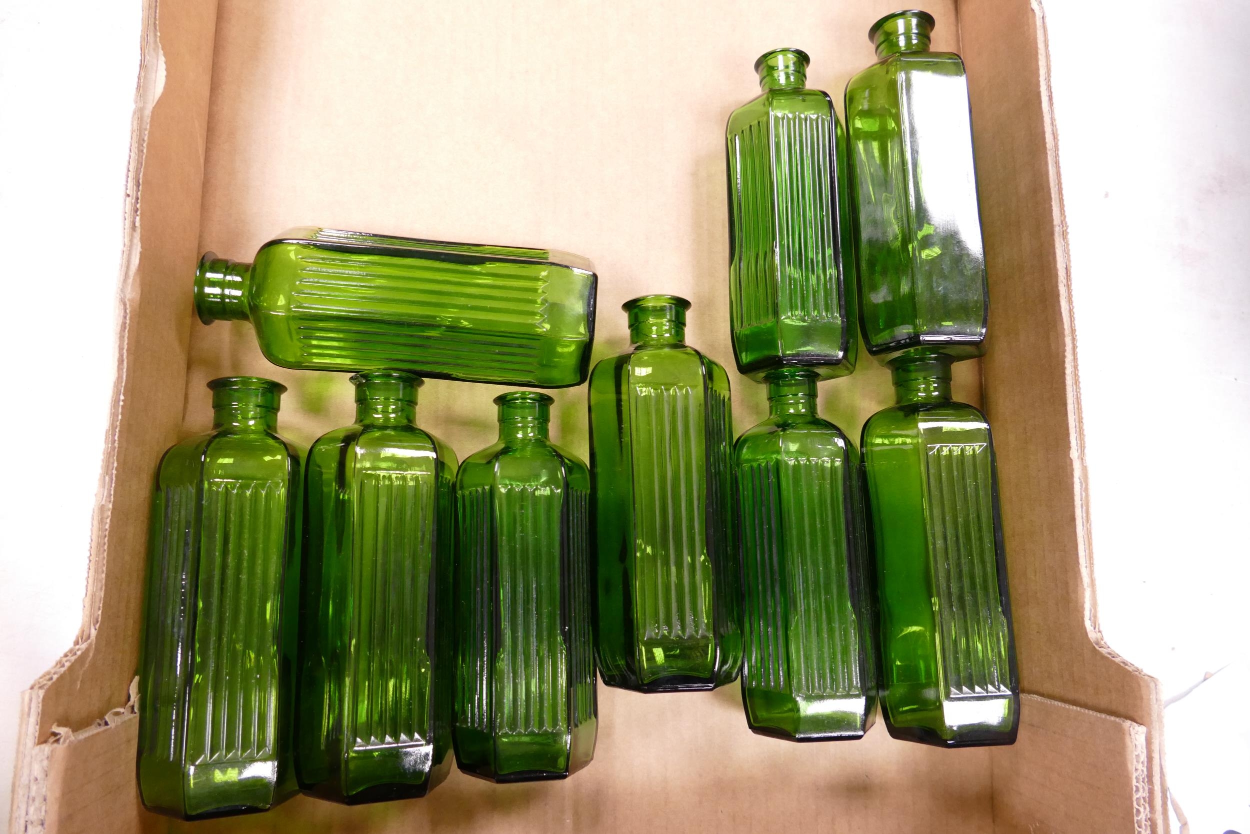 A collection of Early Green Glass Poison Bottles with Ribbed Detail: height of largest 17.4cm(9)