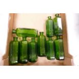 A collection of Early Green Glass Poison Bottles with Ribbed Detail: height of largest 17.4cm(9)