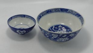 Two Blue & White Chinese Prunus Decorated Bowls: diameter of largest 18cm(2)