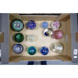 A collection of Glass Paperweights in varying styles & Shapes: