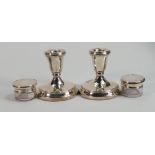 Silver hallmarked items: including pair filled candlesticks and a pair of silver lidded jars. (4)