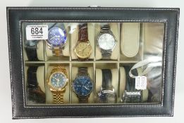 A gentleman's collection of wristwatches: in watch display case. (11)