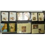 A collection of WWF first day cover stamp albums: comprising three full leather bound albums full of