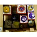 A collection of glass paperweights: mostly boxed (12).