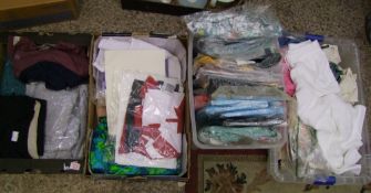 A large quantity of ladies clothing: jumpers, skirts, tops etc (4 trays).