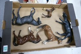 A collection of damaged beswick horses: to include stocky joggy mare ( 1 leg A/F), Black Beauty (
