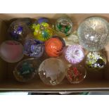 A collection of glass paperweights: (12).