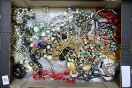 A collection of vintage beads: brooches and similar items