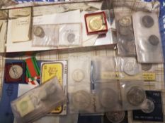A collection of World and commemorative coins: including USA 1 dollars and half dollars, together
