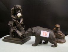Three bronze effect resin figures: Grizzly bear, a boatman and a Darwin chimp, tallest 20cm in