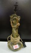 An Art Nouveau bronzed metal figural lamp: