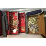 Two jewellery boxes containing a quantity of costume jewellery: brooches, bracelets, necklaces