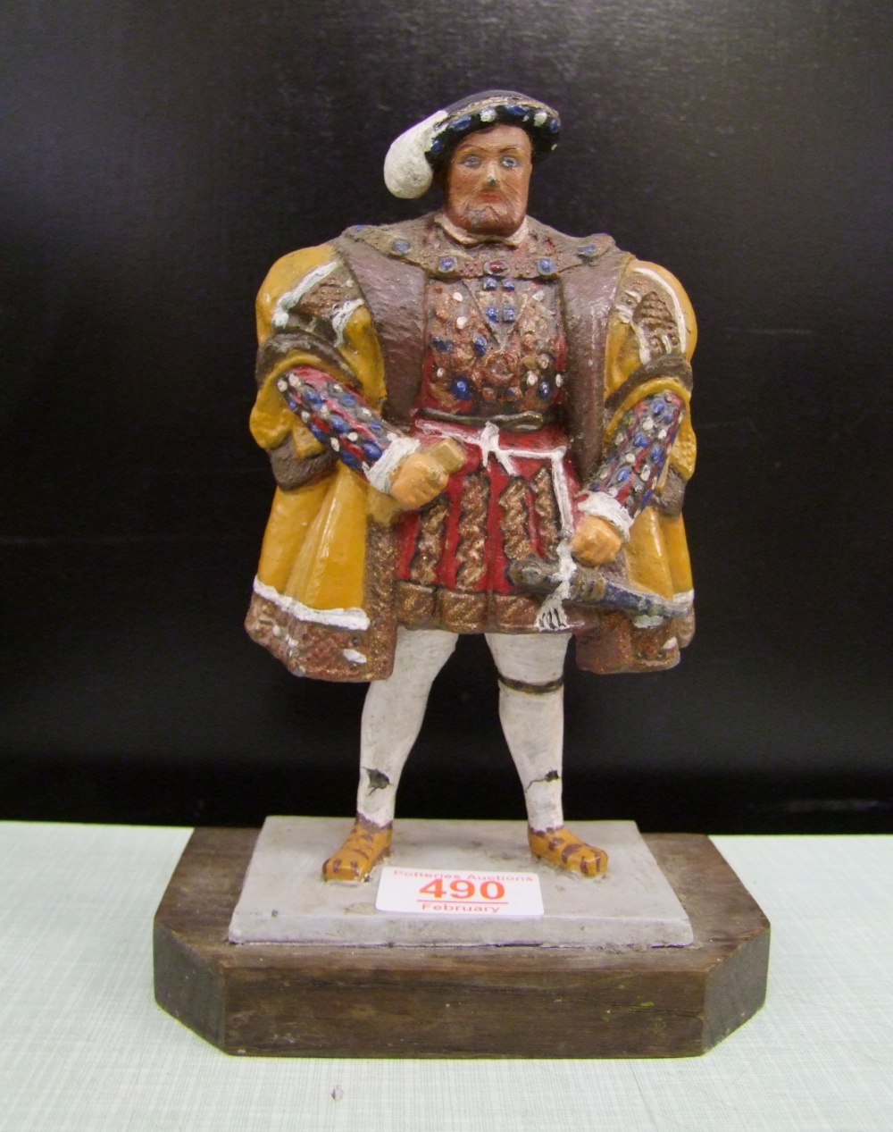 an old painted metal figure of Henry VIII embossed Cast in lead: from the houses of parliament