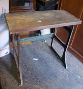 A Mardrive metal sewing table base: with chunky wooden top.