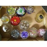 A collection of glass paperweights: (12).