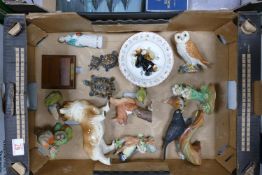 A mixed collection of items to include: Wade Animals, Crown Staffordshire Birds, Beswick Owl etc