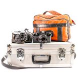 A collection of cased vintage Olympus camera equipment to include: OM-4 & OM-2MD camera bodies,