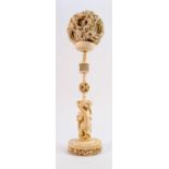 Large 19th century carved ivory puzzle ball on stand with base of carved dragons & foliage: The