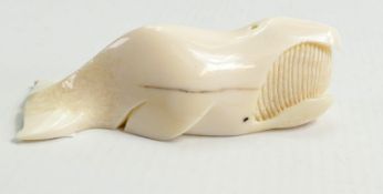 Inuit carved whale Tooth in Form of Sperm Whale: marked Pullock Nome Alaska to under side, length