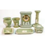 A collection of sage green Wedgwood items to include: Mantle clock, vases, candlestick etc. (7)