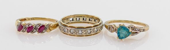 A collection of 9ct ladies rings: Comprising a 9ct gold & diamond ladies dress ring set with three