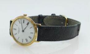 Raymond Weil Geneve gentlemans wristwatch: Gold plated with leather strap.
