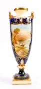 Hand decorated R J Keeling handled vase: With panelled landscape decoration, damage noted to