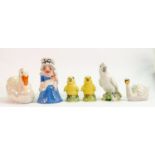 A collection of Wade figures: Including Punch & Judy, large & medium swans and three bird decanters.