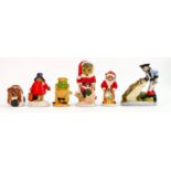 A collection of Wade figures: Including Captain Hook, Paddington Bear, Santa Hedgehog and three
