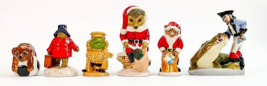 A collection of Wade figures: Including Captain Hook, Paddington Bear, Santa Hedgehog and three