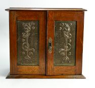 Art Noveau oak smokers cabinet: With terracotta jar (cover broken), 34cm x 30cm x 17cm.