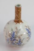 19th century Japanese bottle vase: Decorated with foliage, height 25cm.