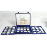 36 x silver crown size coins: Housed in 3 trays each of 12 coins, these are mainly 1 ounce approx.