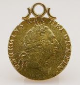 George III spade guinea 22ct gold dated 1787: Mounted as a fob or pendant, gross weight 8.4g.