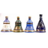 A collection of Wade unopened whisky decanters (4):