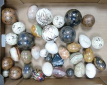 A collection of Onyx & Hard Stone Eggs & Carpet Balls
