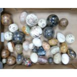 A collection of Onyx & Hard Stone Eggs & Carpet Balls