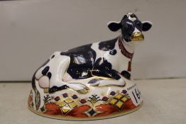 Royal Crown Derby paperweight: Friesian Cow Buttercup, gold stopper.