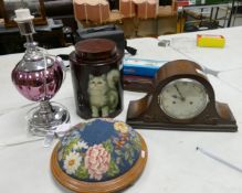 A mixed collection of items to include: Oak Mantle Clock, Chromed Lamp, Footstool & Cat Theme lidded